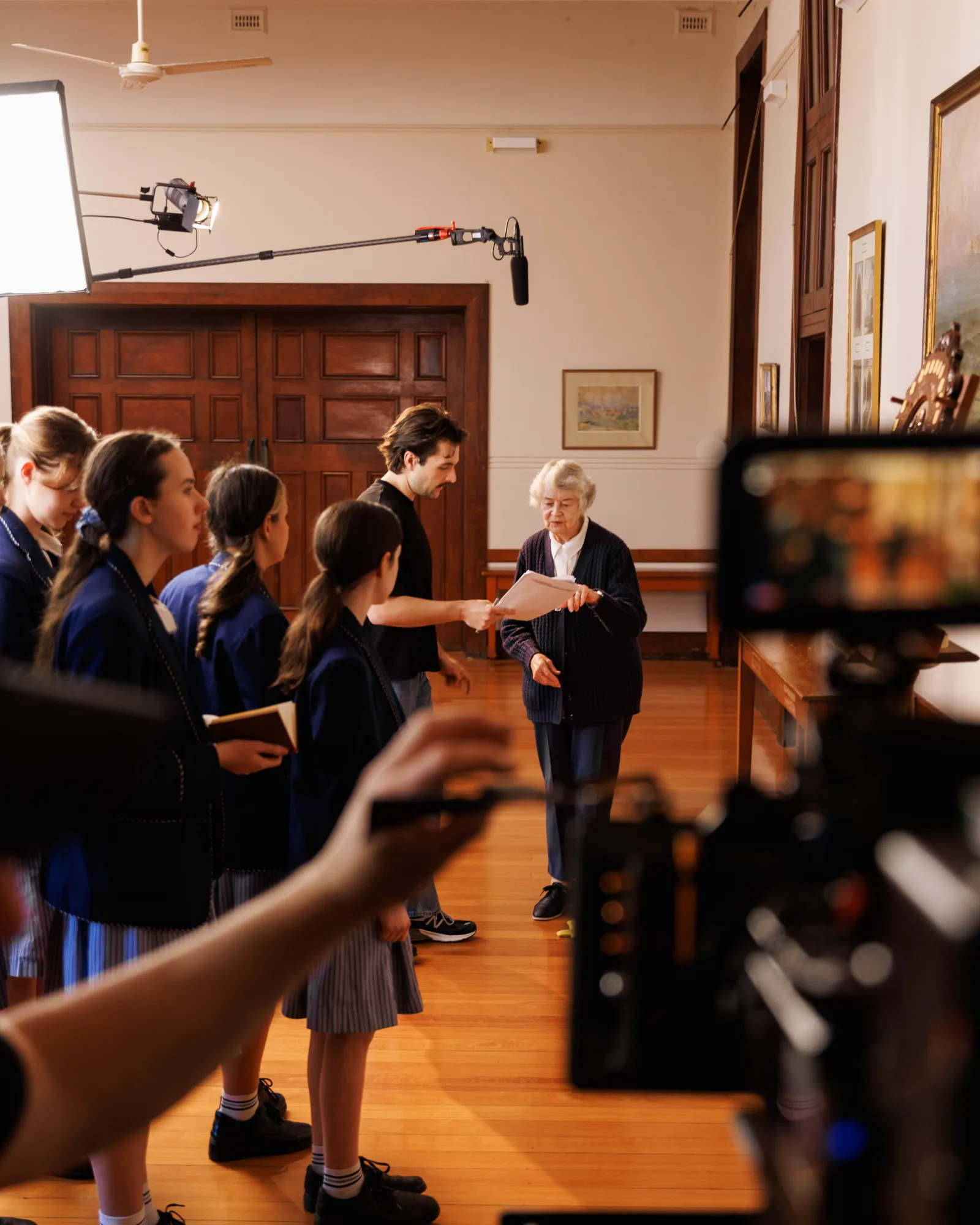 Matt from ShareStory supports Sister Rita in rehearsing her lines before she performs at Stuartholme School in Toowong.