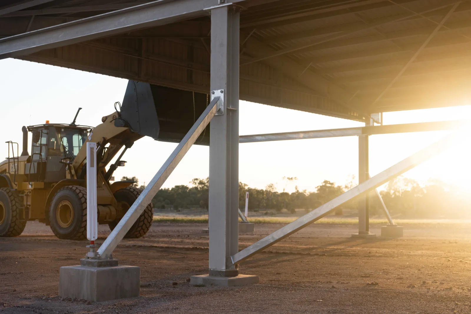 The sun rising on this R&F Steel Building at The Anchorage while ShareStory films the story.