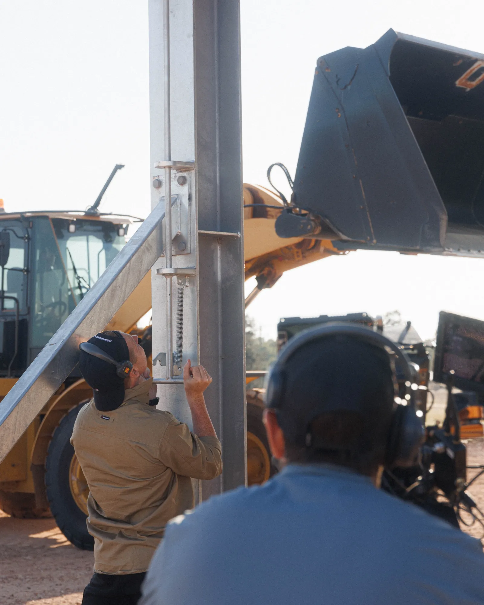 Andrew resets the roof pins on the shed while filming for the R&F Steel Buildings commercial with ShareStory