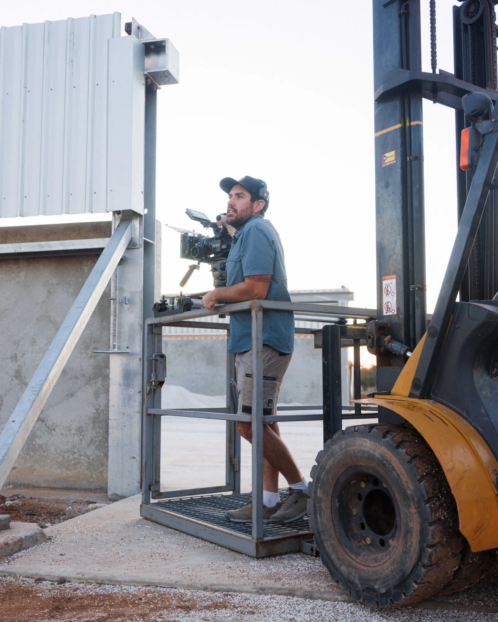 Morgan calls out for direction while filming for the R&F Steel Buildings commercial at Cubbie